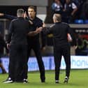 Tempers flare at full-time between Peterborough United Manager Darren Ferguson and West Bromwich Albion manager Valerien Ismael (facing). Popsh assistant manager Mark Robson (right) is also involved. Photo: Joe Dent/theposh.com.