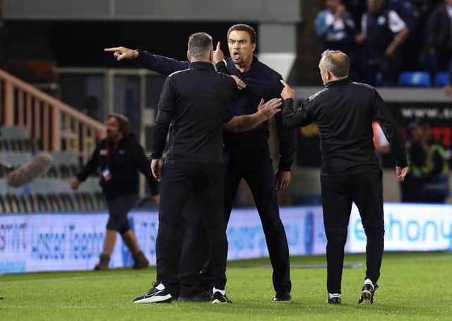 Tempers flare at full-time between Peterborough United Manager Darren Ferguson and West Bromwich Albion manager Valerien Ismael (facing). Popsh assistant manager Mark Robson (right) is also involved. Photo: Joe Dent/theposh.com.