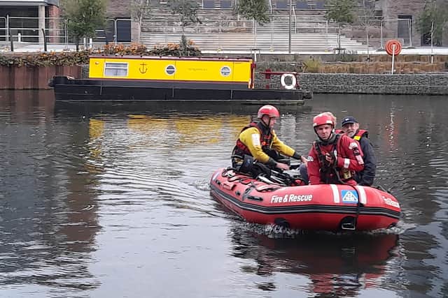 Firefighters carrying out a river rescue on Peterborough's Embankment. Pictures: Mark Mason