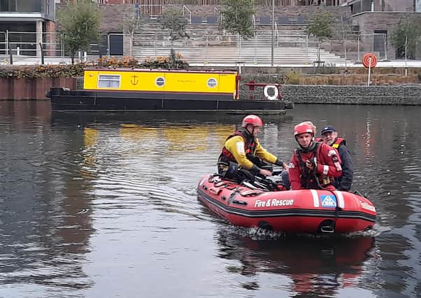 Firefighters carrying out a river rescue on Peterborough's Embankment. Pictures: Mark Mason