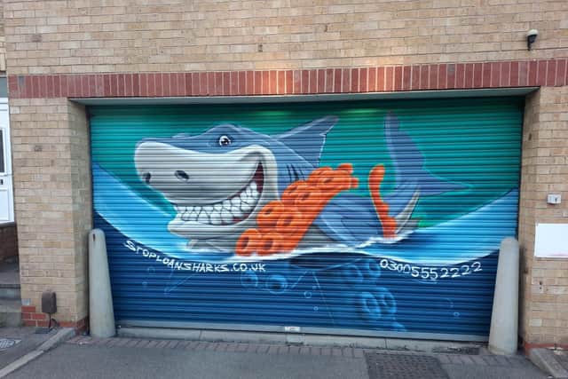 The mural is designed to raise awareness of the dangers of using loan sharks