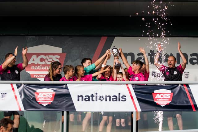 Girls United players with the National Under 12 Aces trophy.