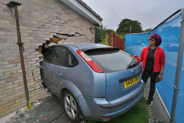 Vigie Hammond, with the car still embedded in her house at Atherstone Avenue