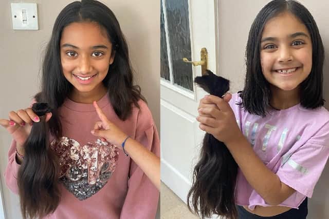 Lily (left) and Lana with the hair they had cut off for the Little Princess Trust.
