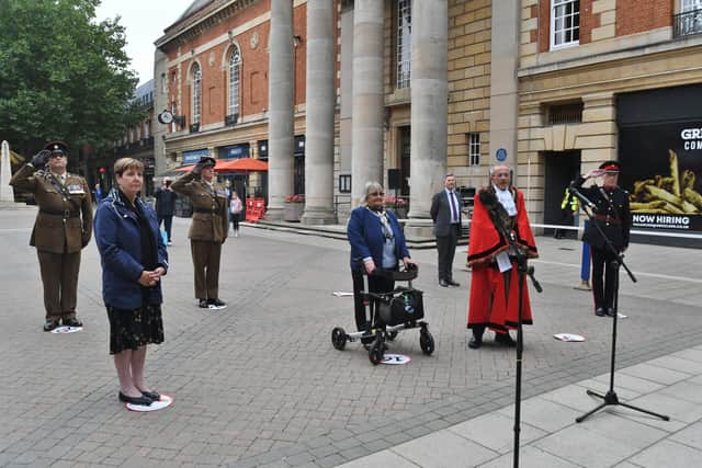 Royal Navy Day . Flying of the Red Ensign outside the Town Hall attended by Mayor of Peterborough Steve Lane and Mayoress Margaret Lane EMN-210309-115711009
