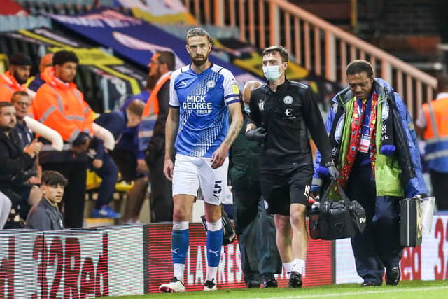 Mark Beevers limps out of the game against Cardiff last month.