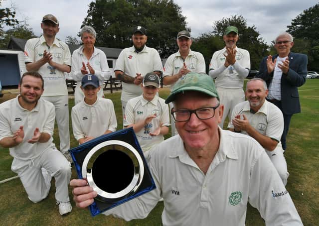 Nigel King received an award from his team mates after playing 1000 games for Castor Cricket Club  Photo: David Lowndes.