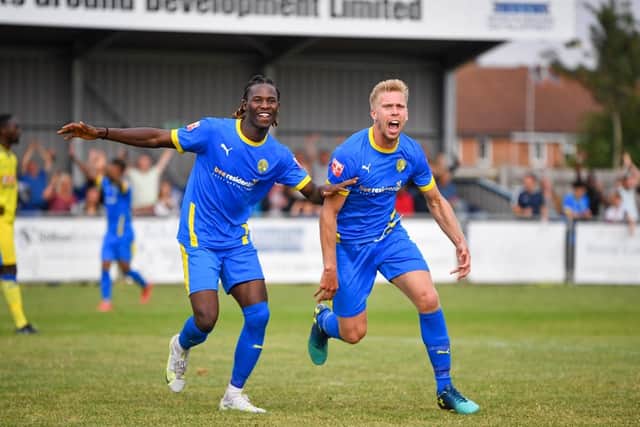 Jim Stevenson (right) and Maniche Sani celebrate the former's winning goal in the FA Cup tie against Haringey. Photo: James Richardson.