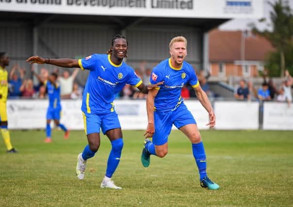 Jim Stevenson (right) and Maniche Sani celebrate the former's winning goal in the FA Cup tie against Haringey. Photo: James Richardson.