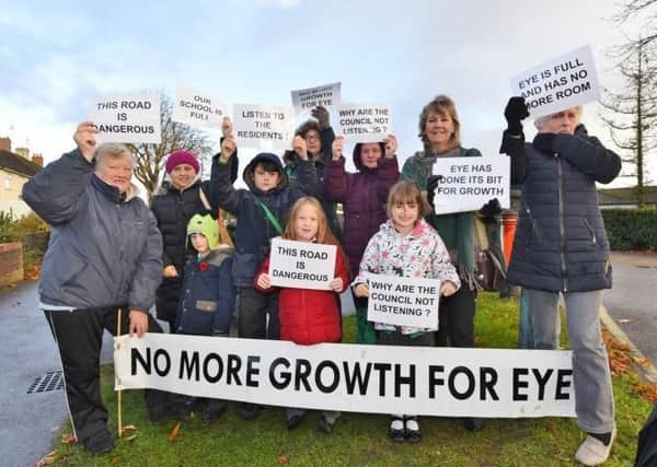 Protestors against the development outside Eye Primary School.