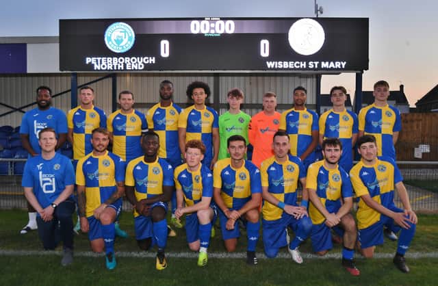Peterborough North End pose in their new shirts in front of the new LED scoreboard at the Bee Arena. Photo: David Lowndes.