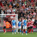 Peterborough United players cut dejected figures after Sheffield United score. Photo: Joe Dent/theposh.com.