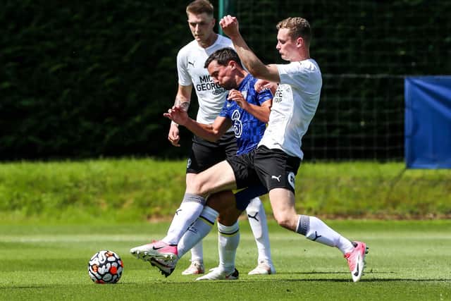 Danny Drinkwater (blue) playing for Chelsea against Posh in the summer.