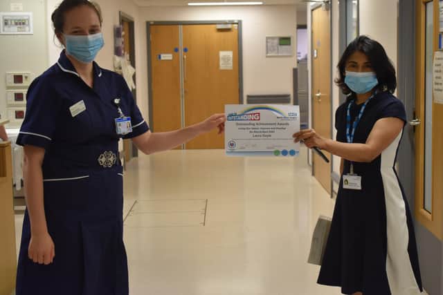 Macmillan Lead Cancer Nurse Laura Doyle receives her Living Our Values: Seeking to Improve and Develop award.