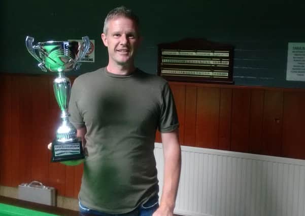 Mark Gray with his legends trophy.