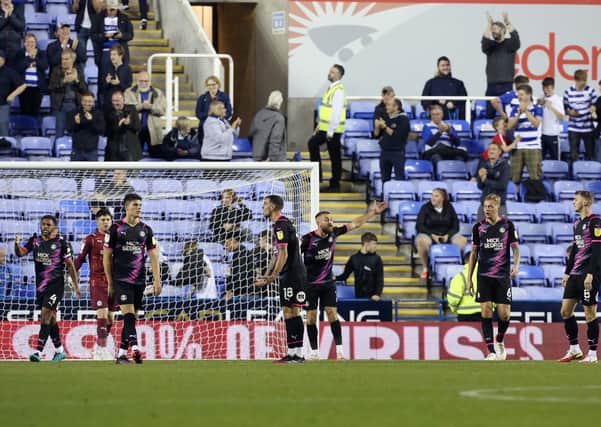 Peterborough United players cut frustrated figures after conceding the second goal of the game at Reading. Photo: Joe Dent/theposh.com.