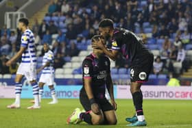 Jonson Clarke-Harris (kneeling) and Nathan Thompson of Peterborough United react after a missed chance to score. Photo: Joe Dent/theposh.com.