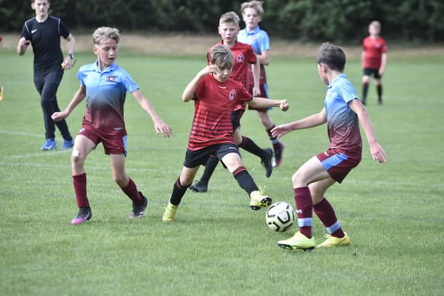 Action from Polonia (red) v Thorpe Wood Rangers under 12s at Nene Valley Community Centre. Photo: David Lowndes.