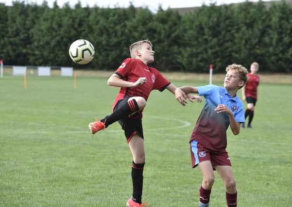 Action from Polonia (red) 2, Thorpe Wood Rangers 6 in Division One of the Junior Alliance Under 12 League. Photo: David Lowndes.