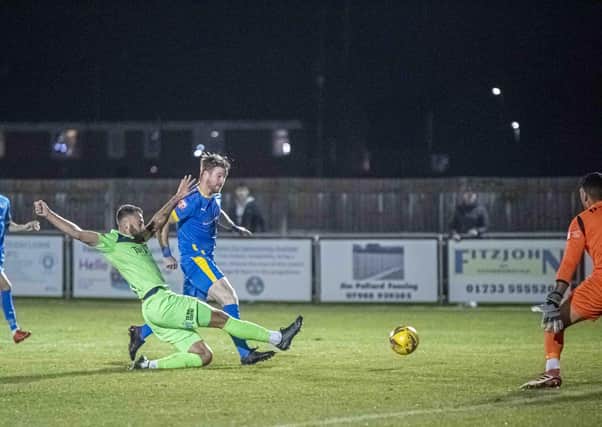 Action from Peterborough Sports' (blue) win over Tamworth. Photo: James Richardson.