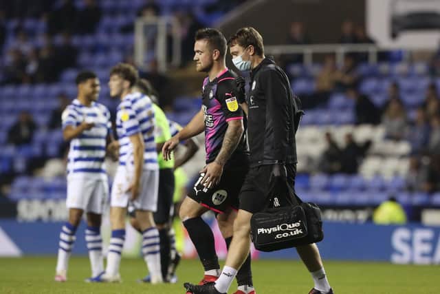 Posh striker Jack Marriott limps off at Reading. Photo: Joe Dent/theposh.com.