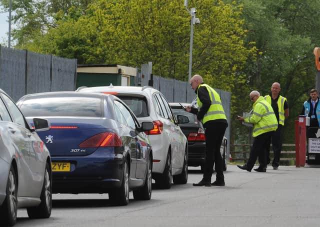 Cars queue up to use the drive-through test centre at the East of England Showground.