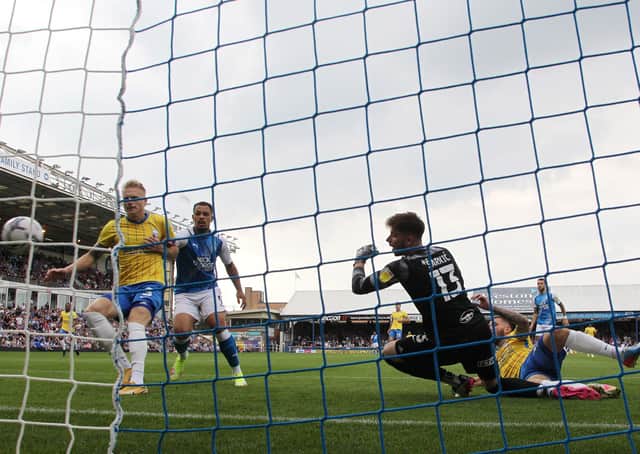 Harlee Dean of Birmingham City scores an own goal to open the scoring for Peterborough United. Photo: Joe Dent/theposh.com.