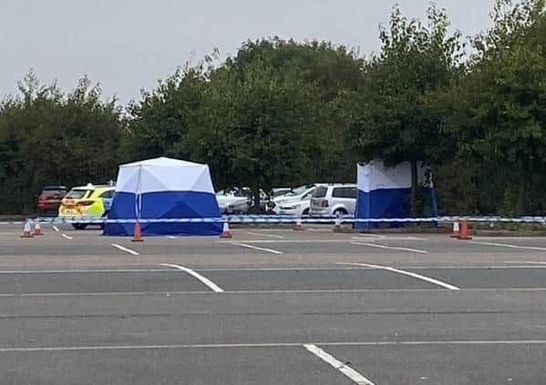 Police set up a cordon in the car park. Pic: PT Reader