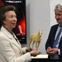 HRH The Princess Royal receives a gift of a golden horse from Photocentric MD Paul Holt made by the company's innovative 3D printing processes. EMN-210920-142643009