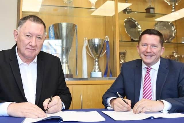 Peterborough United Chief Executive Bob Symns and ARU Peterborough Principal Professor Ross Renton sign the Memorandum of Understanding. Photo: Joe Dent.
