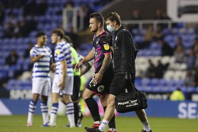 Jack Marriott of Peterborough United leaves the pitch after picking up his injury at Reading. Photo: Joe Dent/theposh.com
