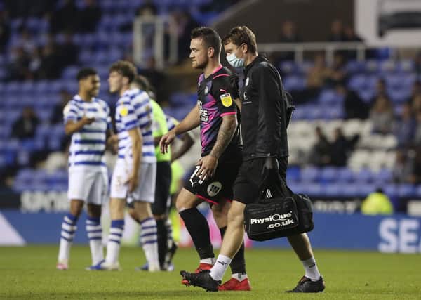Jack Marriott of Peterborough United leaves the pitch after picking up his injury at Reading. Photo: Joe Dent/theposh.com