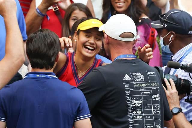 Emma Raducanu celebrates with Andrew Richardson after her US Open win in New York