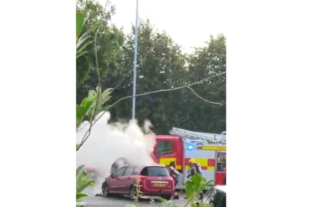 The car caught fire along London Road, Yaxley. Credit: Jason Barnes.
