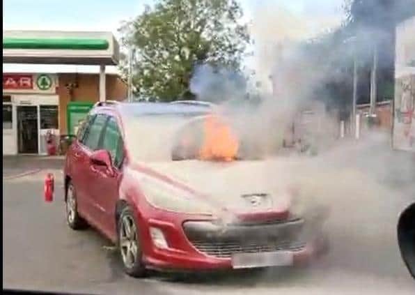 The car caught fire along London Road, Yaxley. Credit: Jason Barnes.