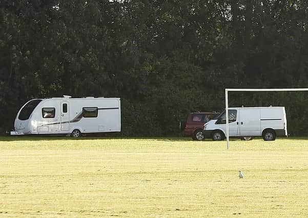 Vehicles parked on Werrington Fields.