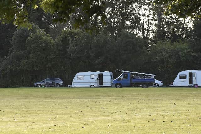 Vehicles parked on Werrington Fields.