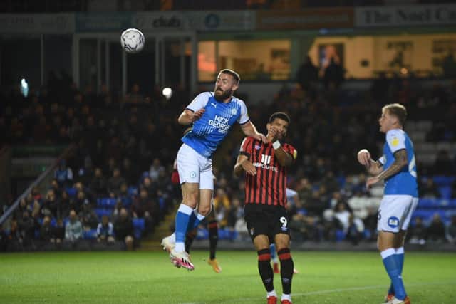 Butler heads the ball away. Photo: David Lowndes.
