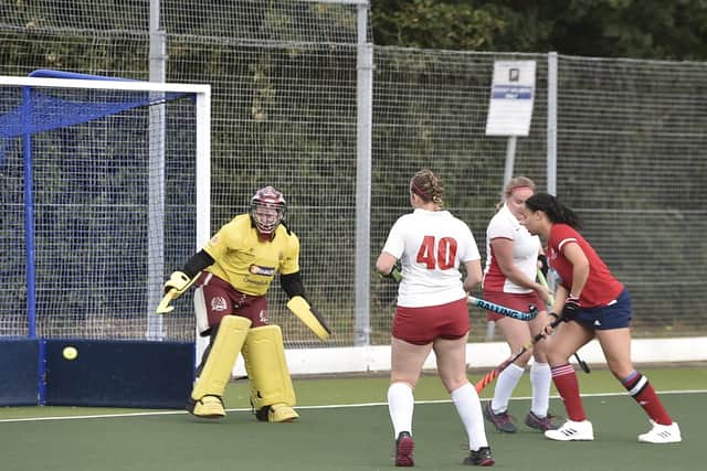 Tierney Augustine (red) opens the scoring for City of Peterborough against Dereham. Photo: David Lowndes.