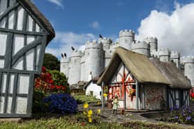 Banksy's work on one of the model houses in the Merrivale Model Village. The artist has confirmed he was behind various pieces of street art which appeared in Suffolk and Norfolk.