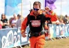 Magpas Air Ambulance Dr Scott crossing the finish line in a previous race.