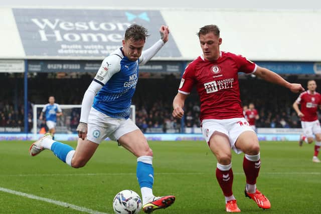 Sammie Szmodics of Peterborough United takes on Cameron Pring of Bristol City. Photo: Joe Dent/theposh.com.