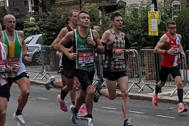 Ben Heron (checked shirt) beat his marathon personal best by over five minutes in his first London Marathon.