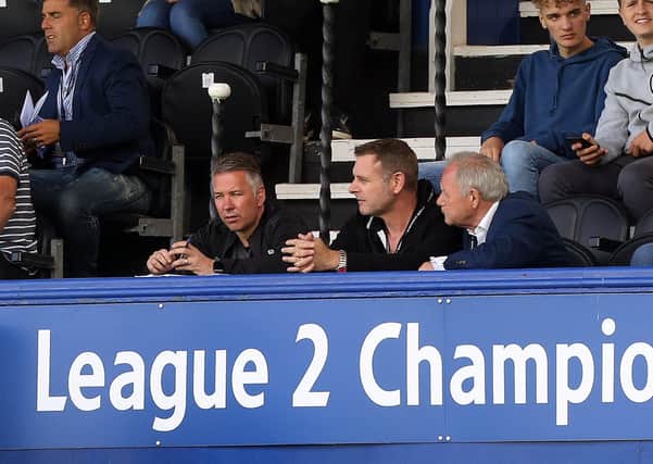 Posh chairman Darragh MacAnthony (centre) with manager Darren Ferguson (left) and director of football Barry Fry.