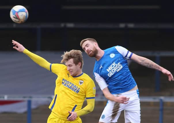 Mark Beevers (right) in action for Posh.