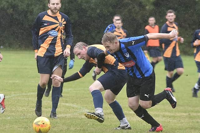Action from Glinton & Northborough's 4-1 win over FC Hampton (blue) in Division Two of the Peterborough League. Photo: David Lowndes.