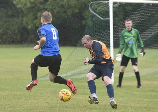 Action from Glinton & Northborough 4, FC Hampton 1 in Division Two of the Peterborough League. Hampton are in blue. Photo: David Lowndes.