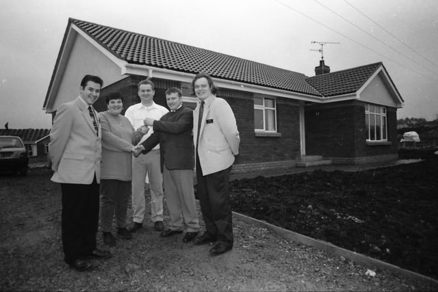 Derek McFeeley, second from left, D Mak Construction, Brecenlea Park, Claudy, presenting the keys to the buyers of the first house, Mr. James and Mrs. Joanne O’Hara. Also included, from left, are Stephen McCarron and Andrew Shields, Century 21/McIvor Homes Estate Agents.