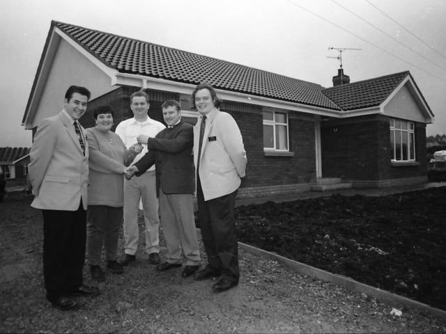 Derek McFeeley, second from left, D Mak Construction, Brecenlea Park, Claudy, presenting the keys to the buyers of the first house, Mr. James and Mrs. Joanne O’Hara. Also included, from left, are Stephen McCarron and Andrew Shields, Century 21/McIvor Homes Estate Agents.