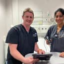 Critical care consultant Dr Toby Edmunds and trainee doctor Dhanya Sebastian with one of the Butterfly devices.
